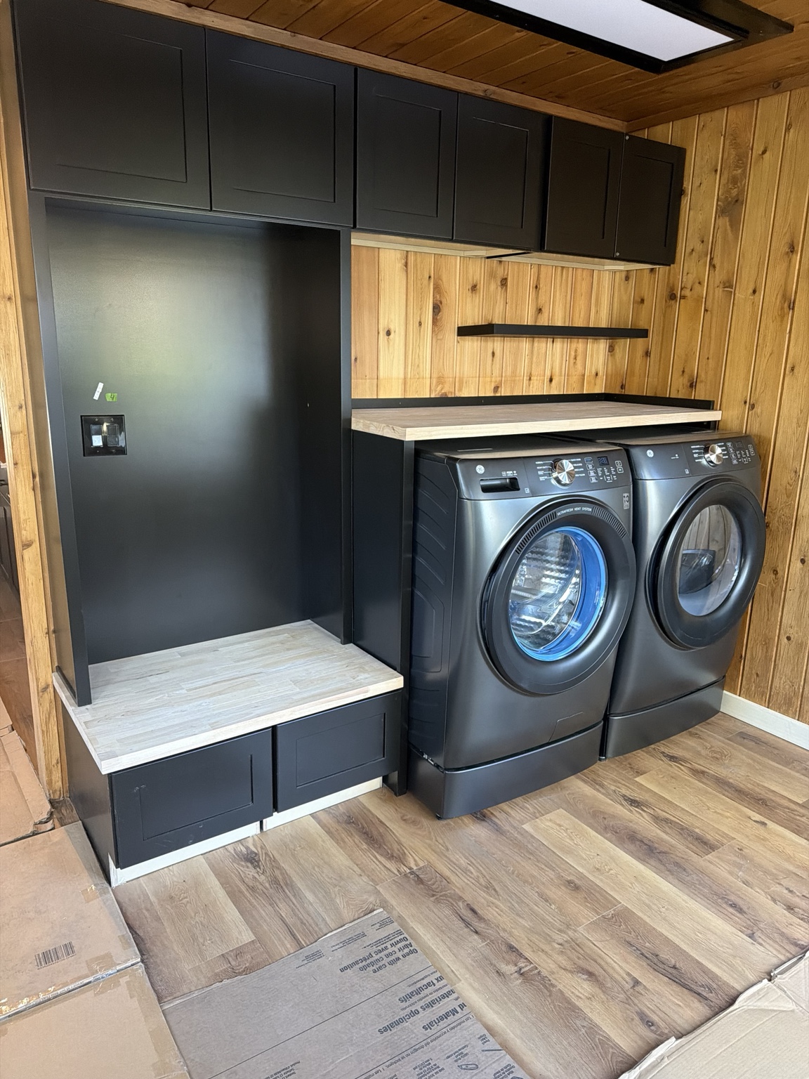 Finished custom laundry and mudroom with built-in cabinetry